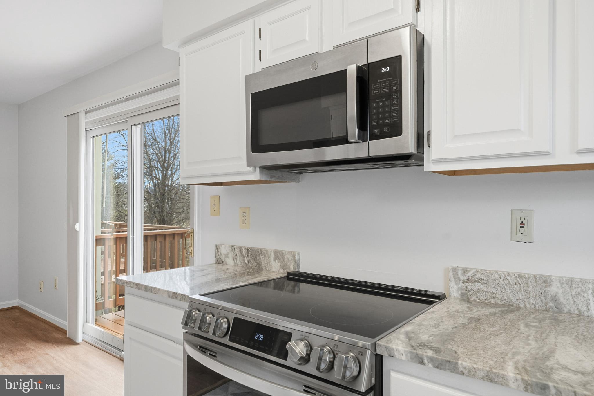 9146 Hardesty Drive Clinton, MD 20735 - Photo 24 of 47 a kitchen with a stove and a microwave