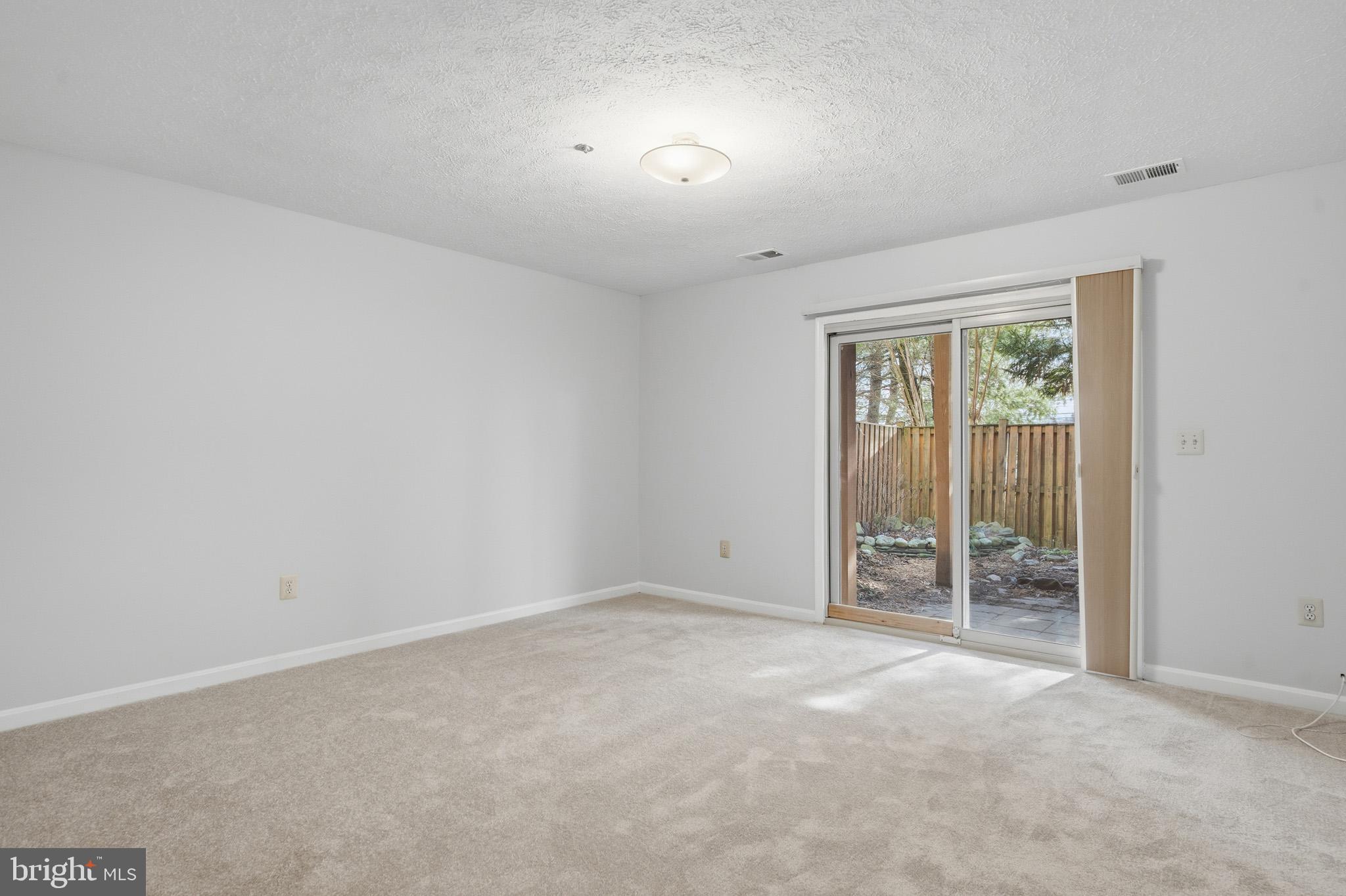 9146 Hardesty Drive Clinton, MD 20735 - Photo 9 of 47 an empty room with windows and closet