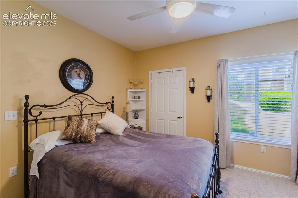 4008 Riviera Grove, Unit 103 Colorado Springs, CO 80922 - Photo 24 of 39 The second bedroom has a walk-in closet and ceiling fan.