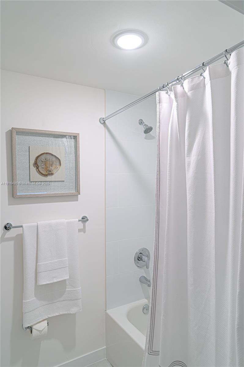 514 Southwest 22nd Avenue, Unit 204 Miami, FL 33135 - Photo 14 of 22 a bathroom with a shower and a tub