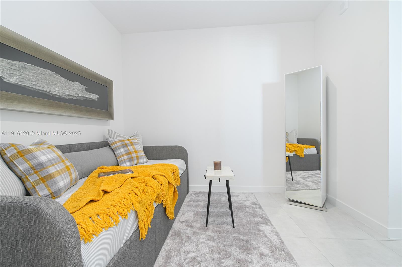 514 Southwest 22nd Avenue, Unit 204 Miami, FL 33135 - Photo 18 of 22 a view of a bedroom with wooden floor and window