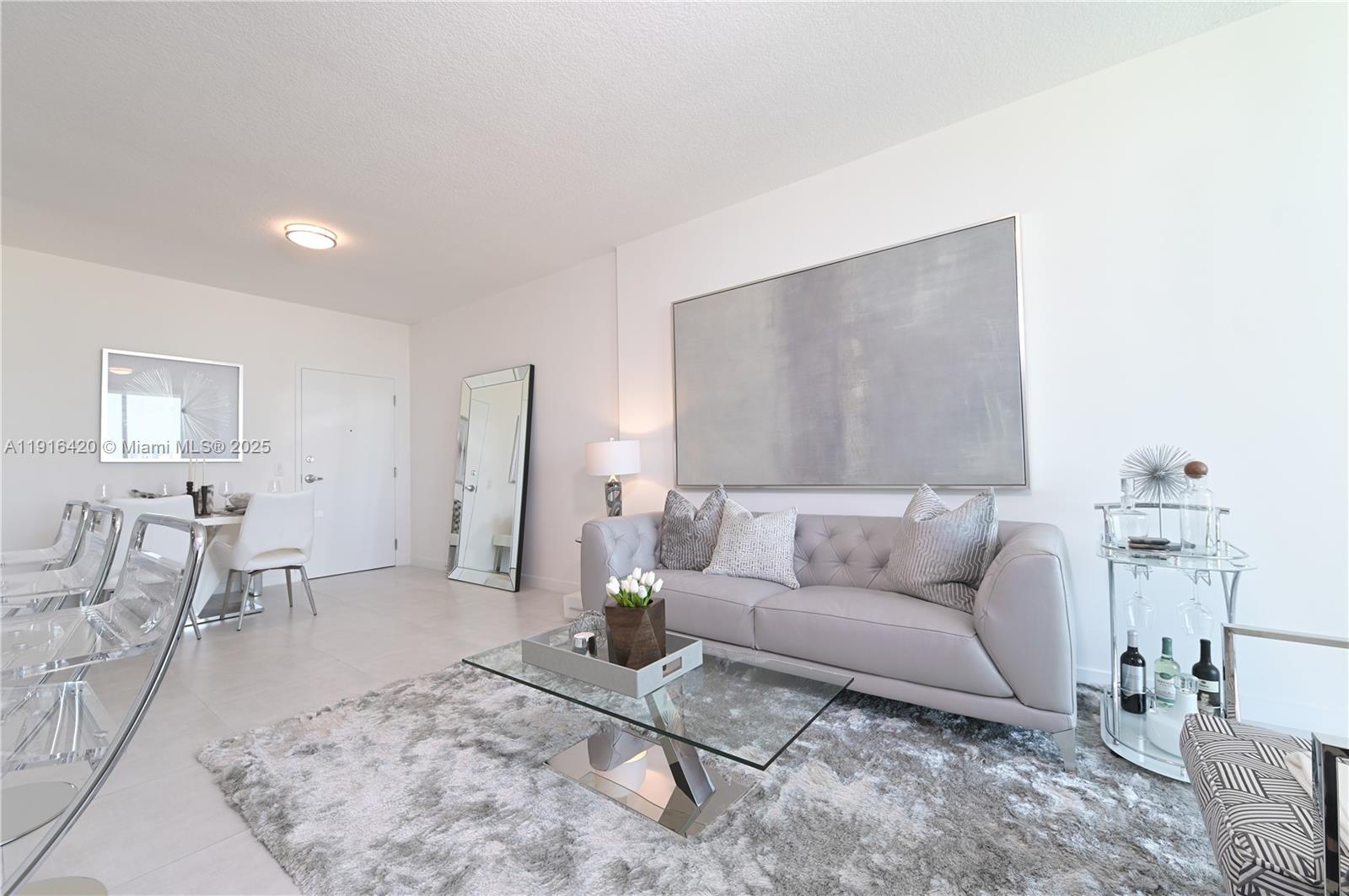 514 Southwest 22nd Avenue, Unit 204 Miami, FL 33135 - Photo 2 of 22 a living room with furniture and white walls