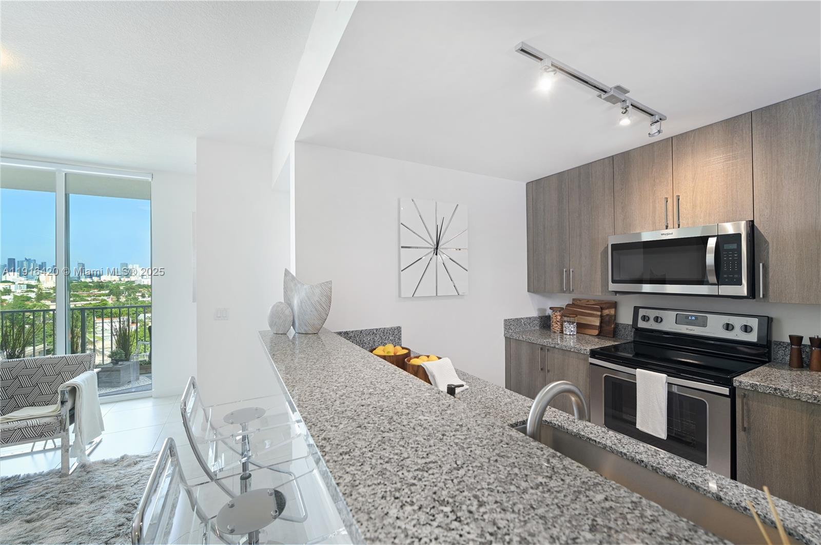 514 Southwest 22nd Avenue, Unit 204 Miami, FL 33135 - Photo 7 of 22 a living room with furniture appliances and a flat screen tv