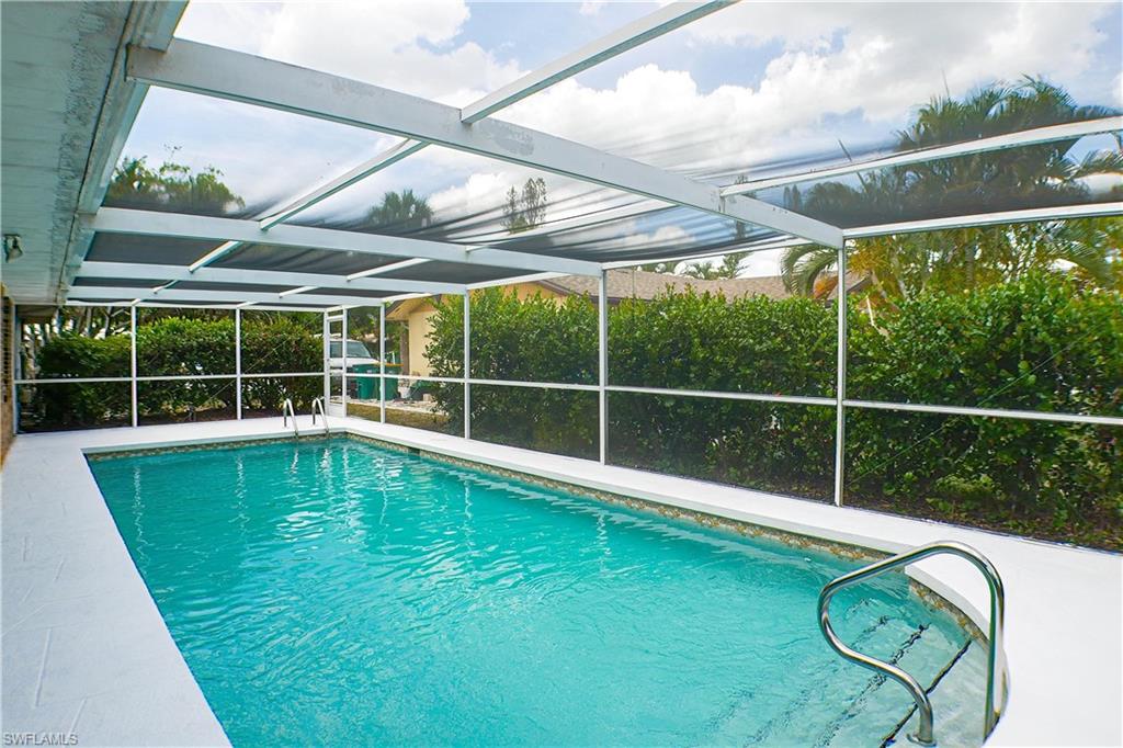 1056 Cardinal Street Naples, FL 34104 - Photo 12 of 32 View of swimming pool with screen enclosure