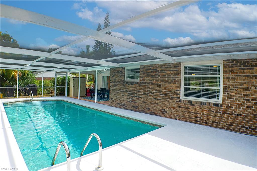 1056 Cardinal Street Naples, FL 34104 - Photo 13 of 32 View of swimming pool with a patio and a lanai
