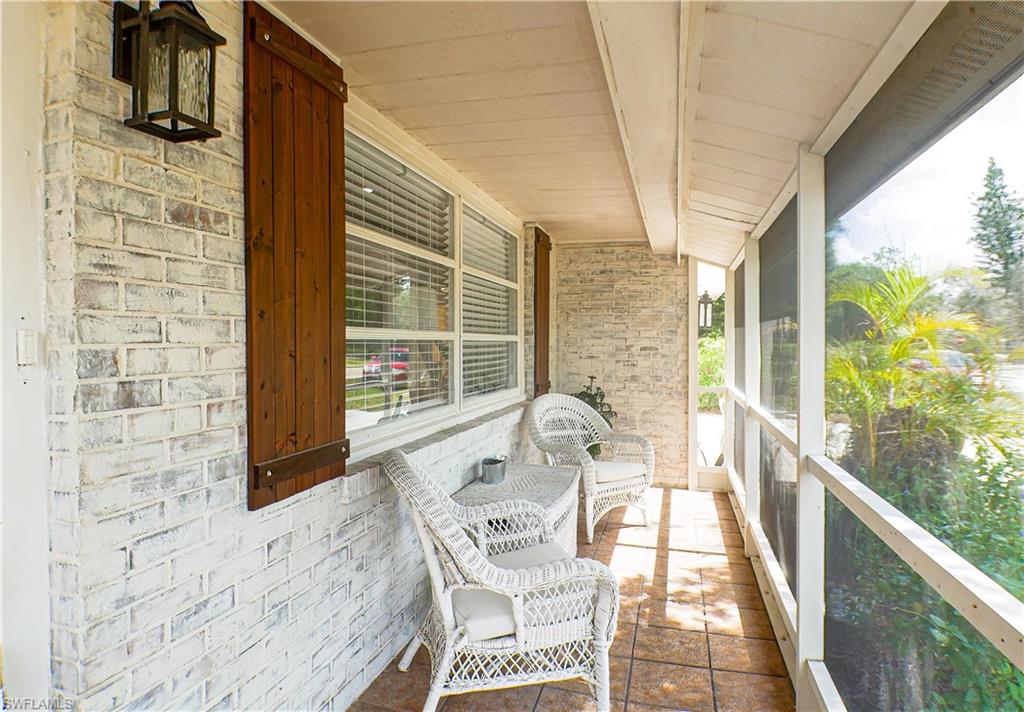 1056 Cardinal Street Naples, FL 34104 - Photo 15 of 32 Front screened-in patio
