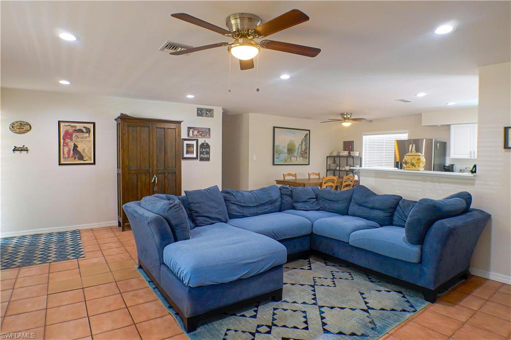 1056 Cardinal Street Naples, FL 34104 - Photo 3 of 32 Tiled living room with ceiling fan