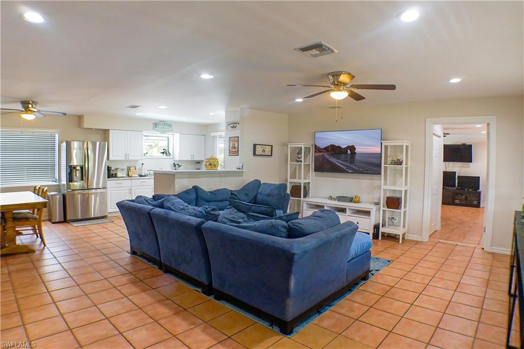1056 Cardinal Street Naples, FL 34104 - Photo 4 of 32 Living room with ceiling fan and tile floors