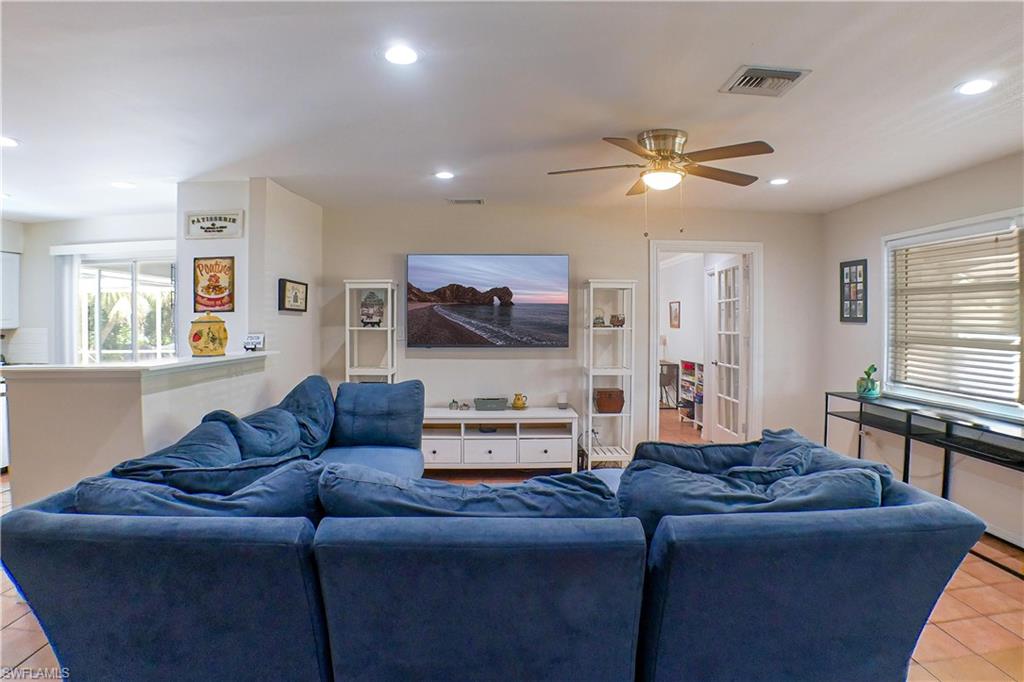 1056 Cardinal Street Naples, FL 34104 - Photo 5 of 32 Living room with ceiling fan and tile floors