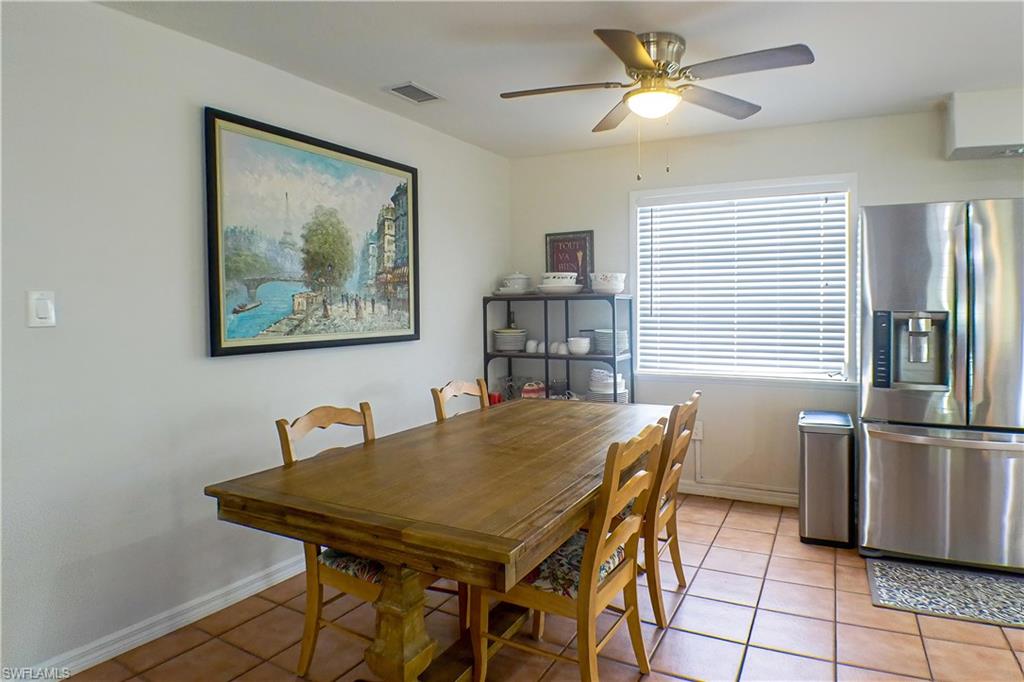 1056 Cardinal Street Naples, FL 34104 - Photo 9 of 32 Dining area featuring ceiling fan and tile floors