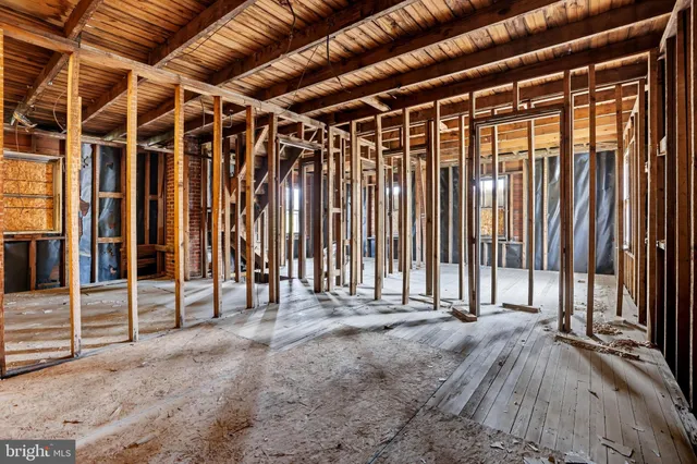 a view of a room with wooden walls
