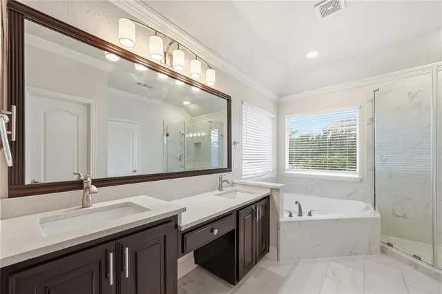 a bathroom with a double vanity sink and a bathtub