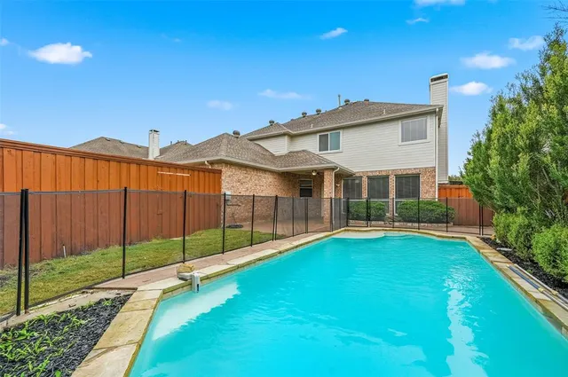 a view of a house with a yard and porch