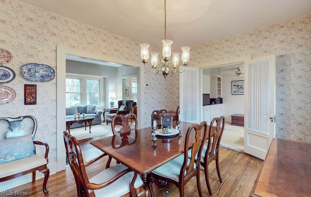 3189 Chadbourne Road Cleveland, OH 44120 - Photo 6 of 25 Dining area featuring hardwood / wood-style floors and ceiling fan with notable chandelier