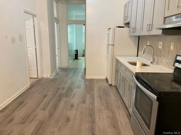 a kitchen with a sink and cabinets