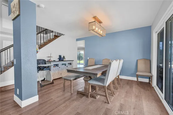 a view of a kitchen with wooden floor and a sink