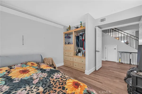 a bedroom with bed and a window