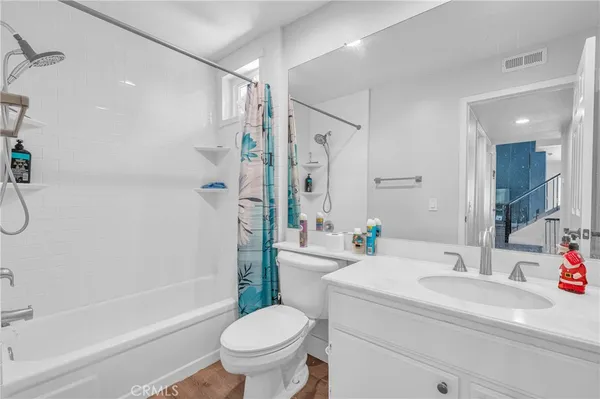 a bathroom with a tub and sink