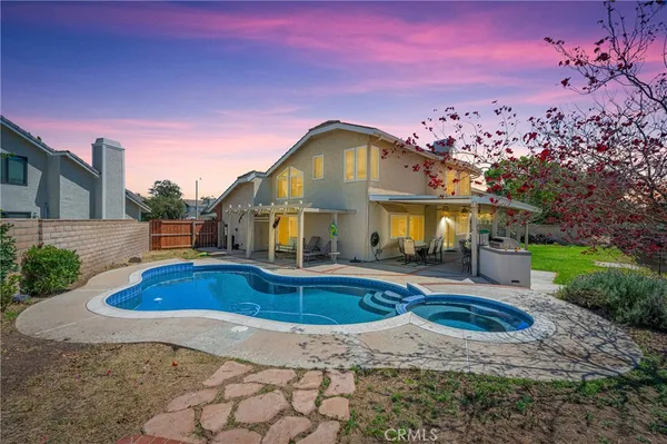 an aerial view of a house with outdoor space