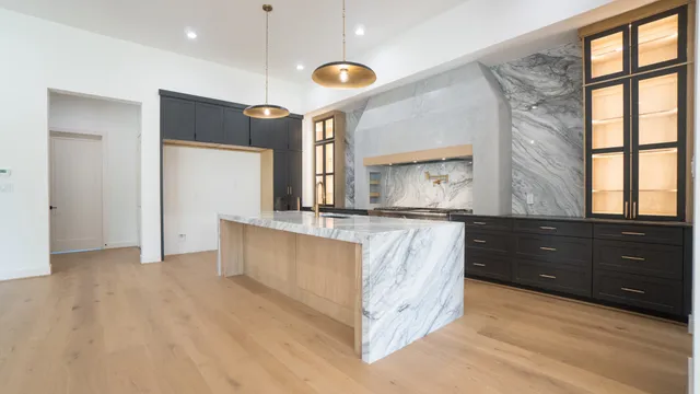 a kitchen with a refrigerator and a sink