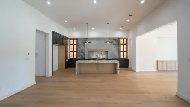 a living room with a couch and a dresser