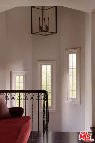 a front view of a house with outdoor seating