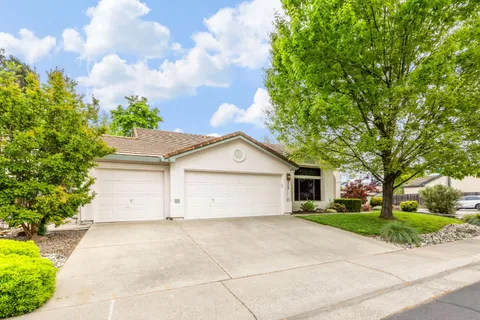 a view of garage yard and tree