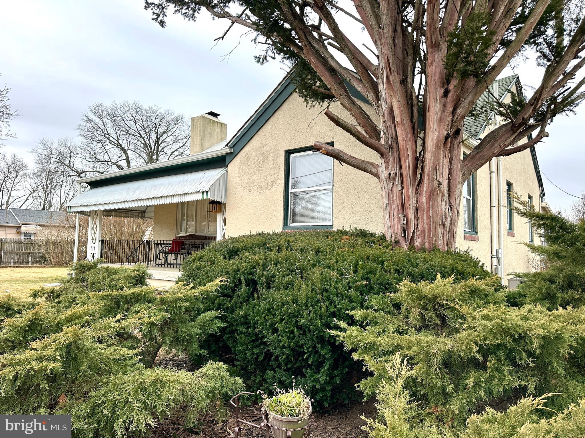 716 Rosa Avenue Croydon, PA 19021 - Photo 127 of 127 a front view of a house with a yard and potted plants