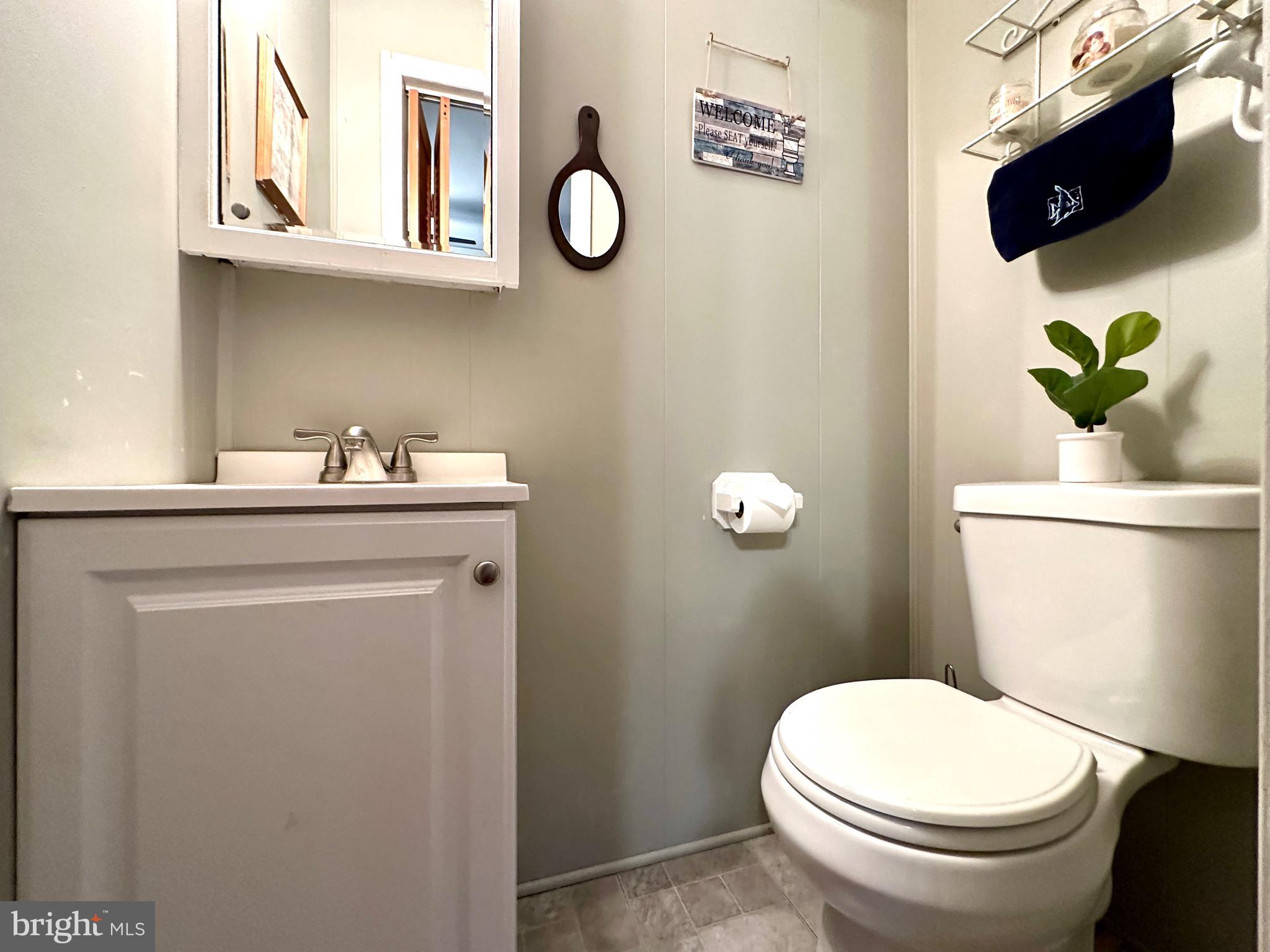 716 Rosa Avenue Croydon, PA 19021 - Photo 17 of 127 a bathroom with a toilet a sink and mirror