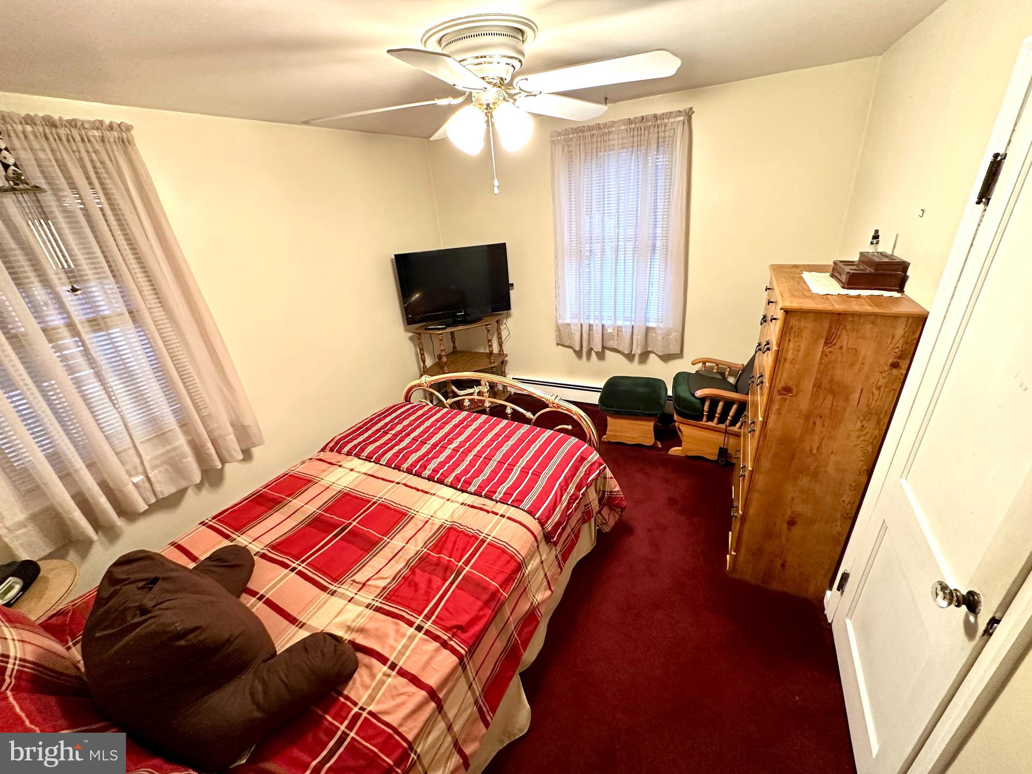 716 Rosa Avenue Croydon, PA 19021 - Photo 62 of 127 a bedroom with a bed and a flat screen tv