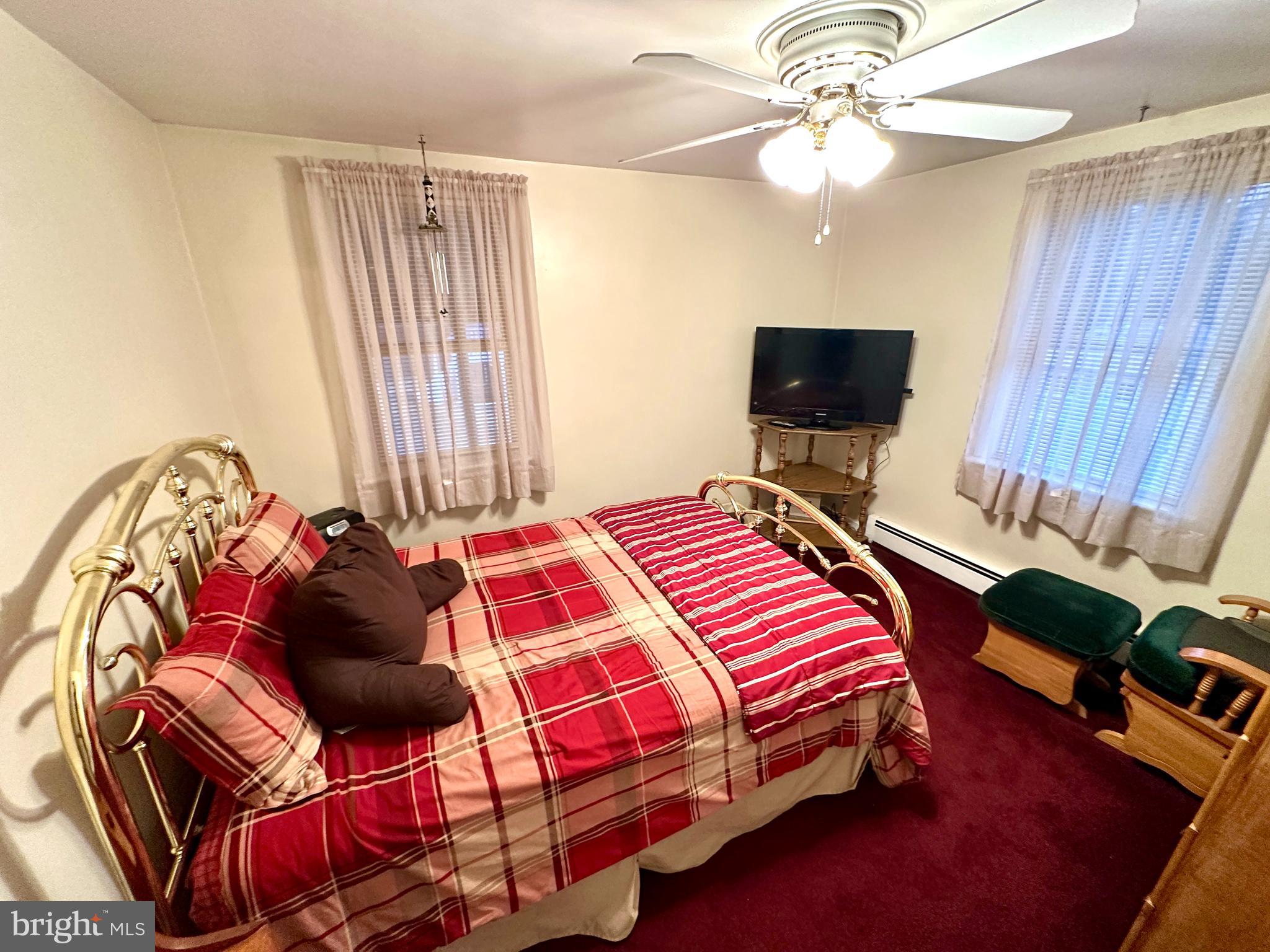 716 Rosa Avenue Croydon, PA 19021 - Photo 63 of 127 a bedroom with a bed and a chandelier