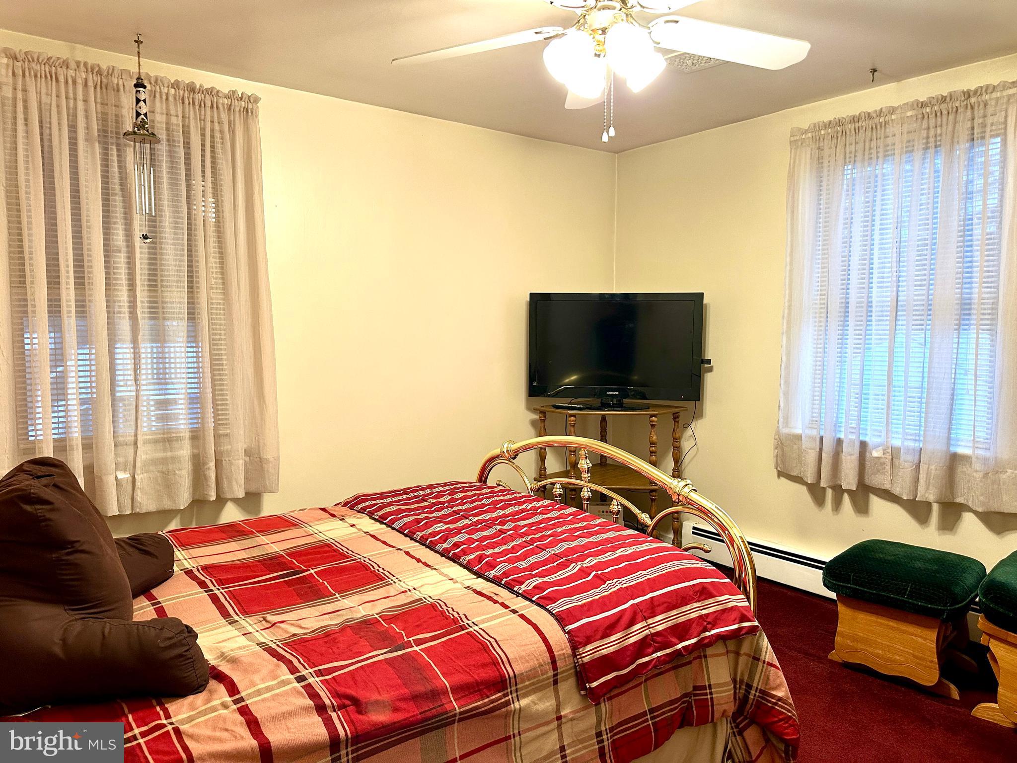 716 Rosa Avenue Croydon, PA 19021 - Photo 64 of 127 a bedroom with a bed and a flat screen tv