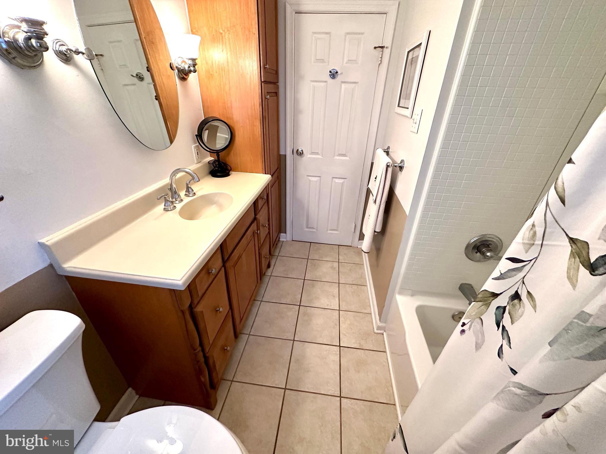 716 Rosa Avenue Croydon, PA 19021 - Photo 75 of 127 a bathroom with a sink mirror vanity and toilet