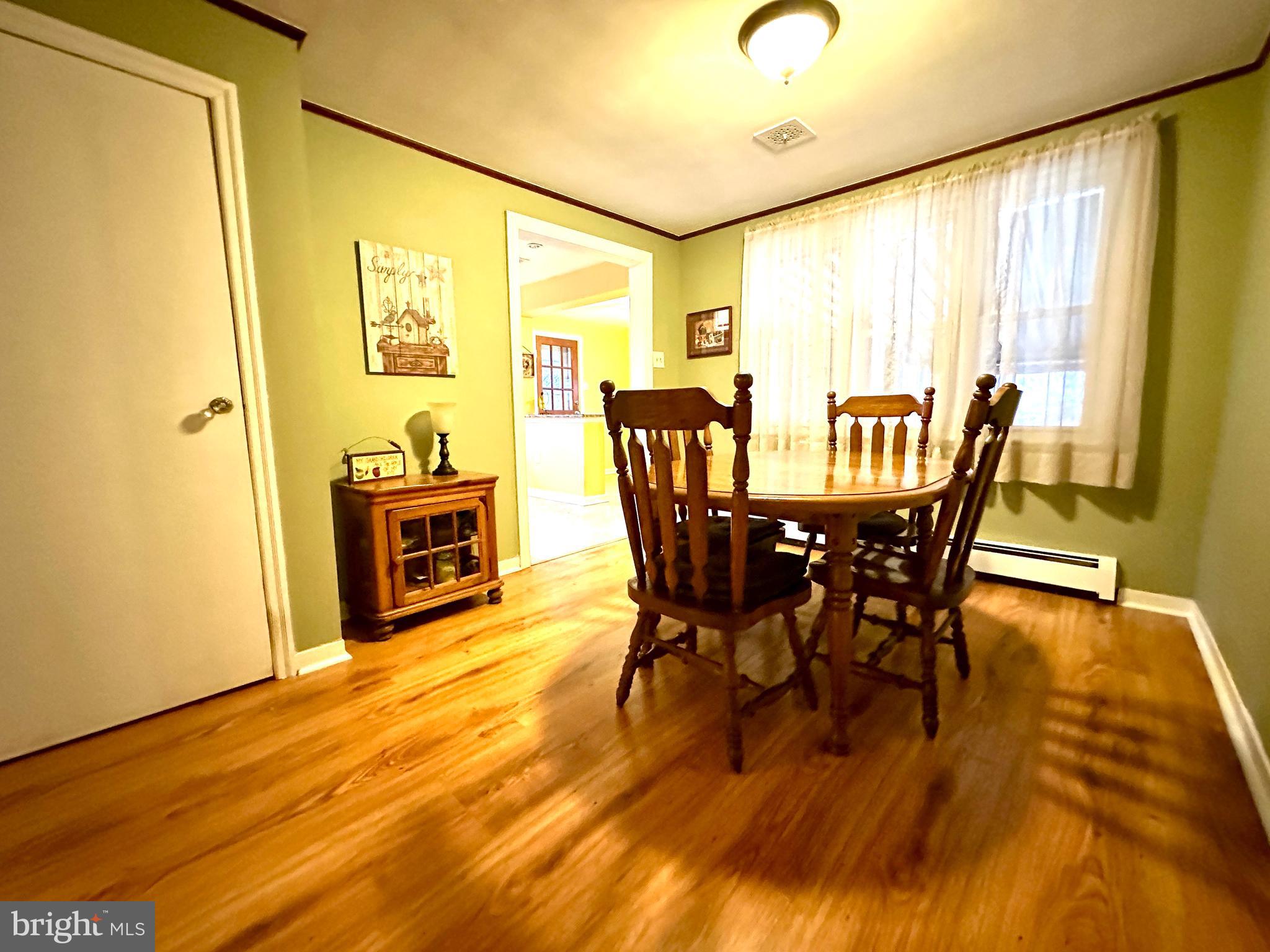 716 Rosa Avenue Croydon, PA 19021 - Photo 91 of 127 a view of a dining room with furniture and wooden floor