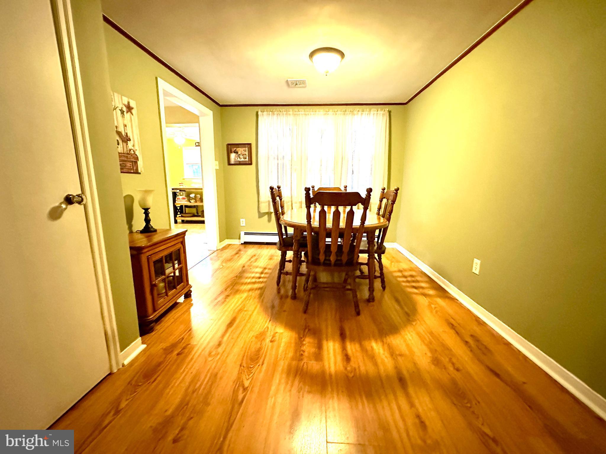 716 Rosa Avenue Croydon, PA 19021 - Photo 92 of 127 a view of a dining room with furniture and wooden floor