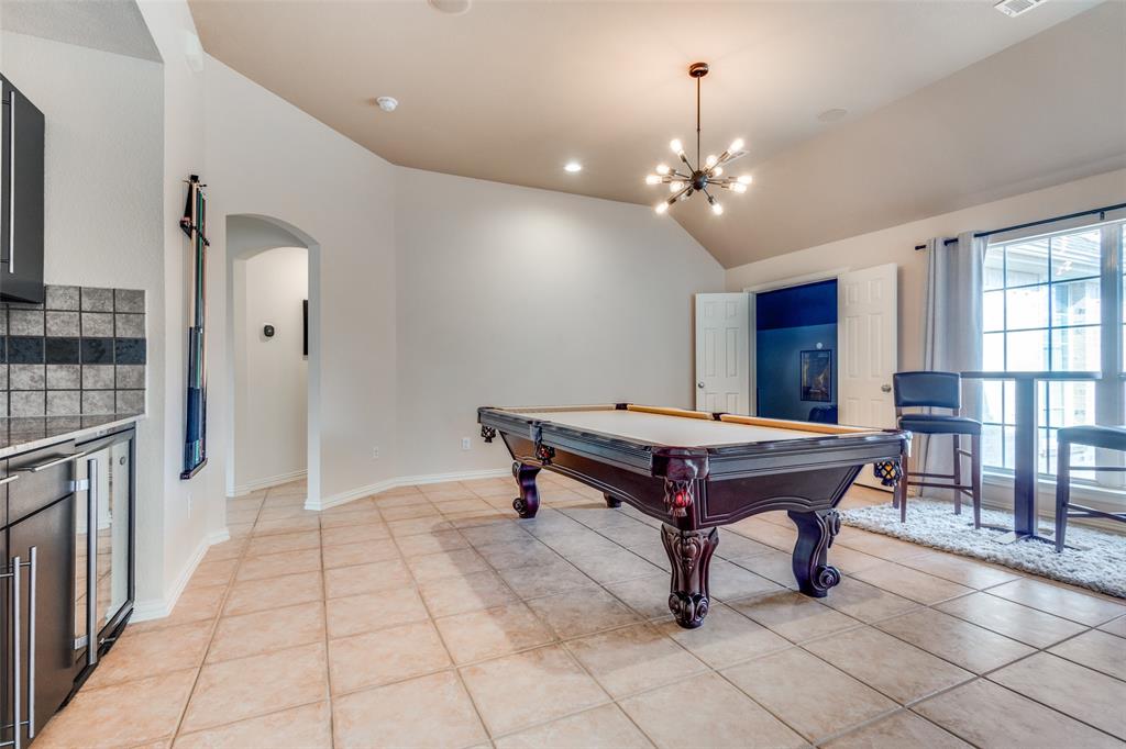 3313 Madison Avenue Hurst, TX 76054 - Photo 9 of 36 Game room includes wet bar and wine fridge.
