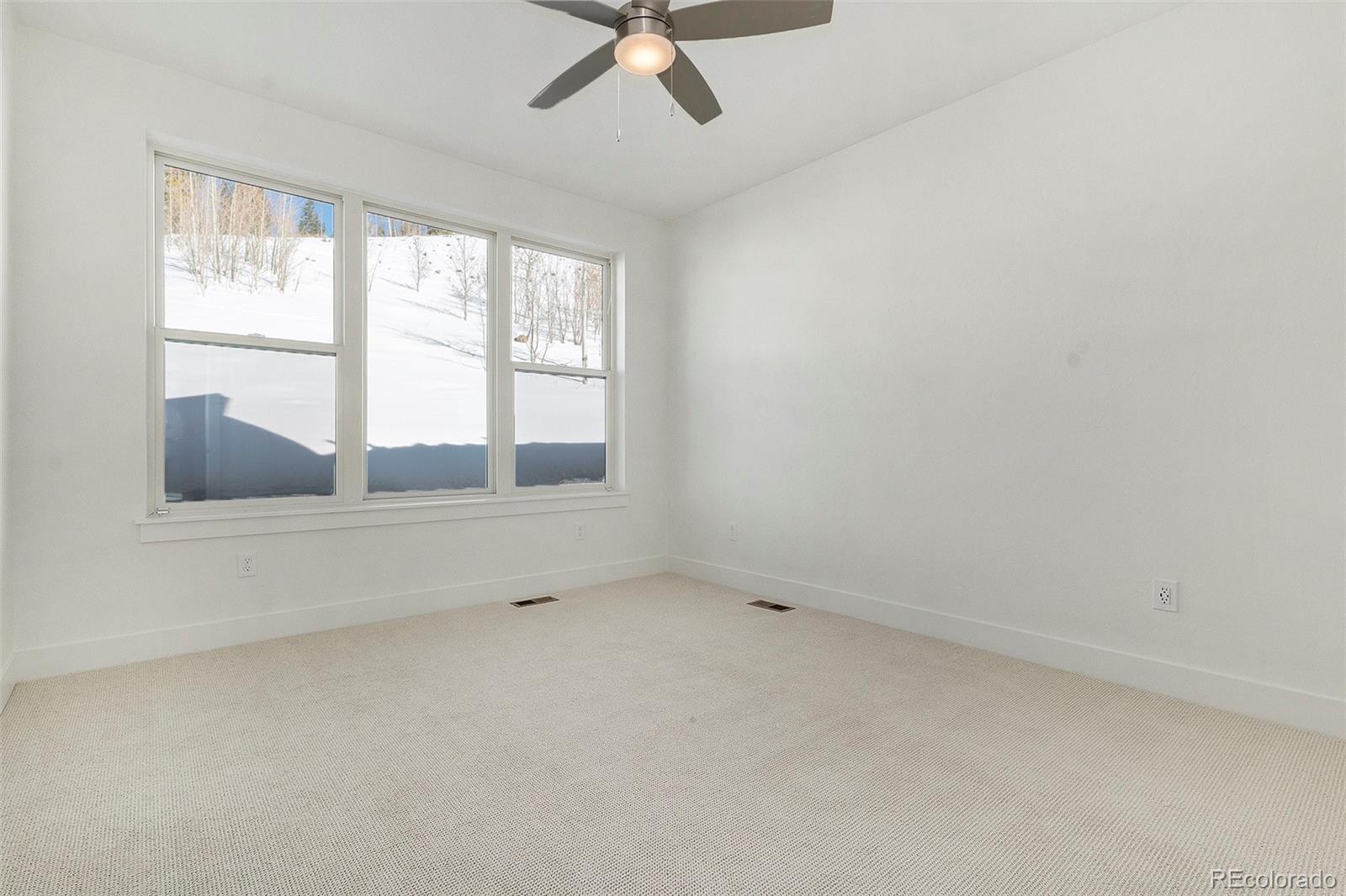 86 High Grove Loop Fraser, CO 80442 - Photo 11 of 20 an empty room with windows