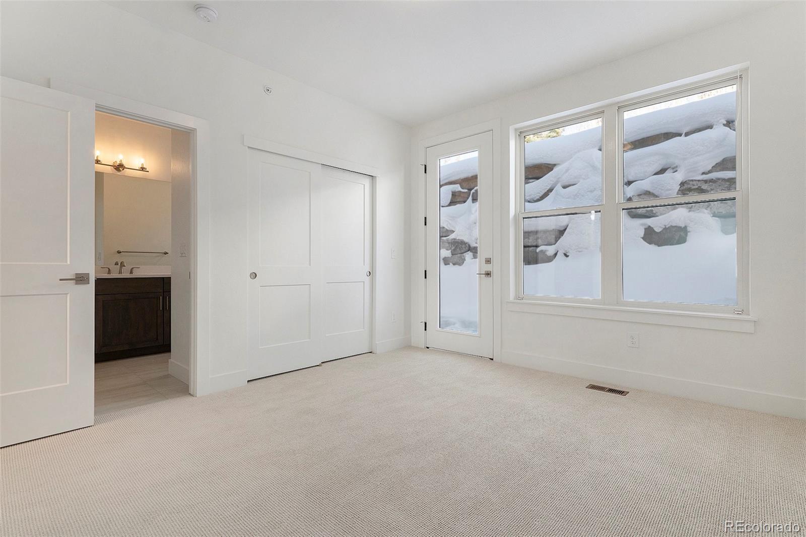 86 High Grove Loop Fraser, CO 80442 - Photo 6 of 20 an empty room with windows and closet