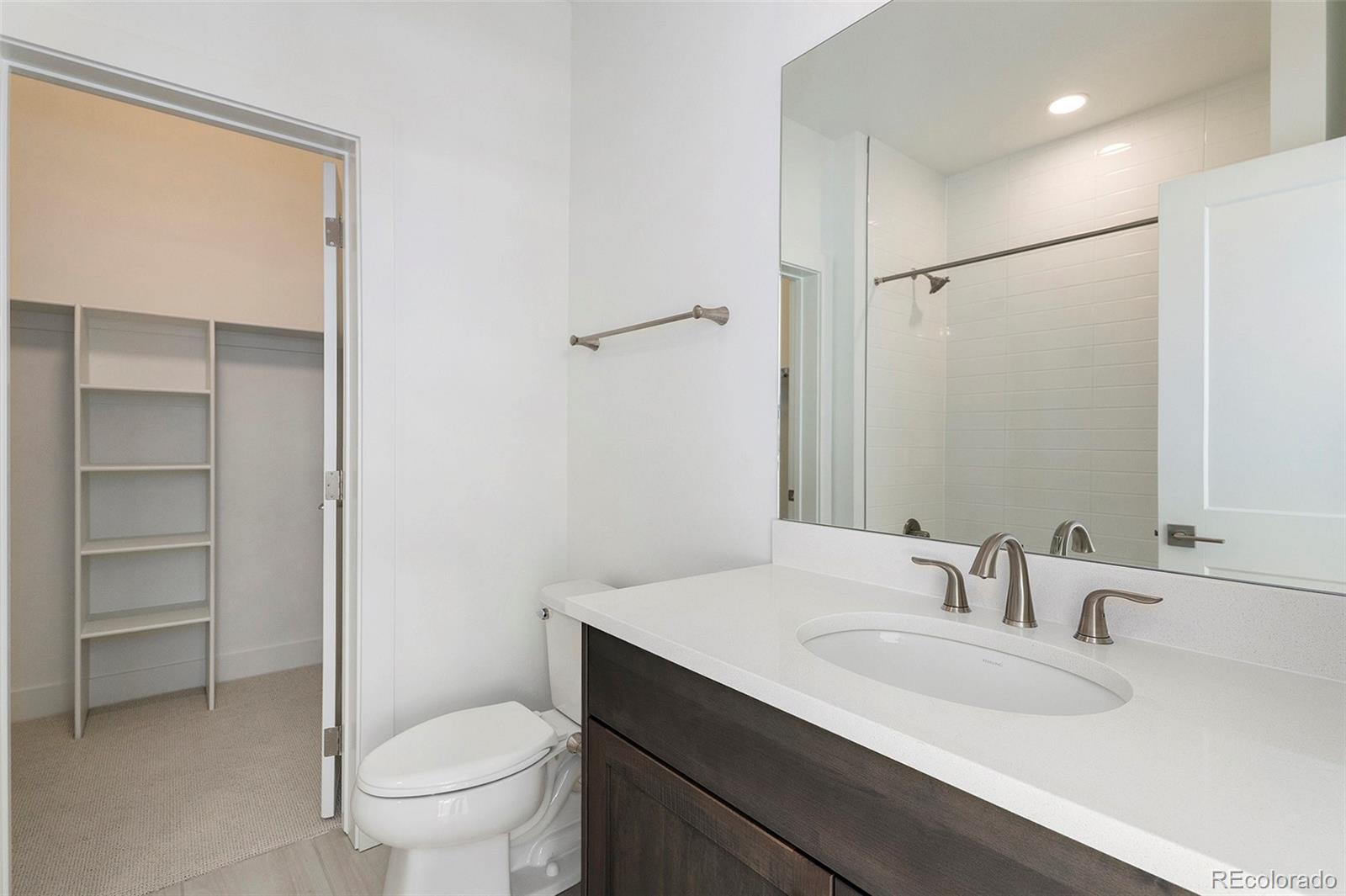 86 High Grove Loop Fraser, CO 80442 - Photo 8 of 20 a bathroom with a sink toilet vanity and shower