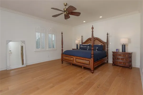 a bedroom with furniture and a chandelier