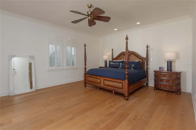 a bedroom with furniture and a chandelier