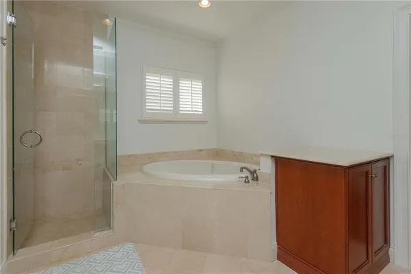 a bathroom with a shower and a sink