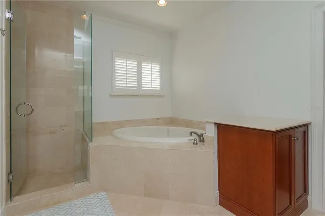 a bathroom with a shower and a sink