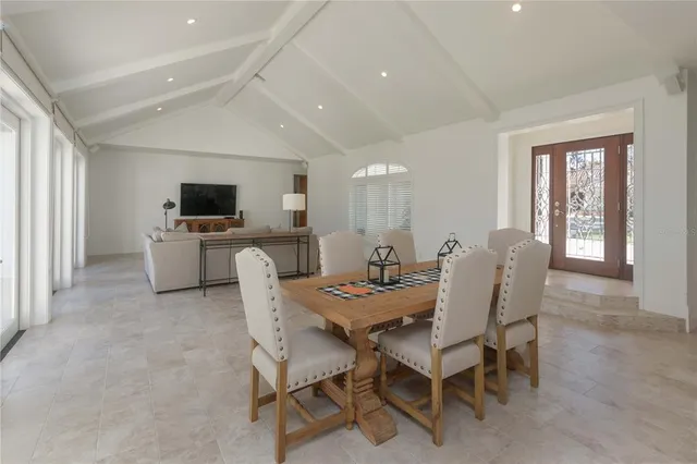 a dining room with furniture and window