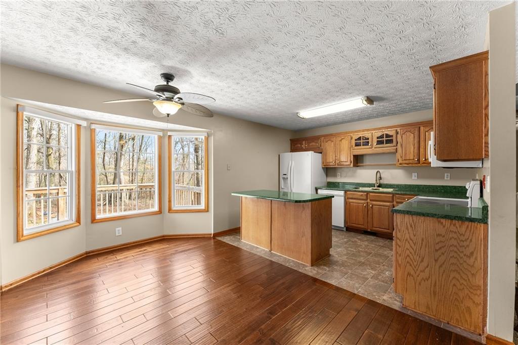 662 Maley Road Jefferson, GA 30549 - Photo 12 of 43 a large kitchen with a large counter top appliances and cabinets