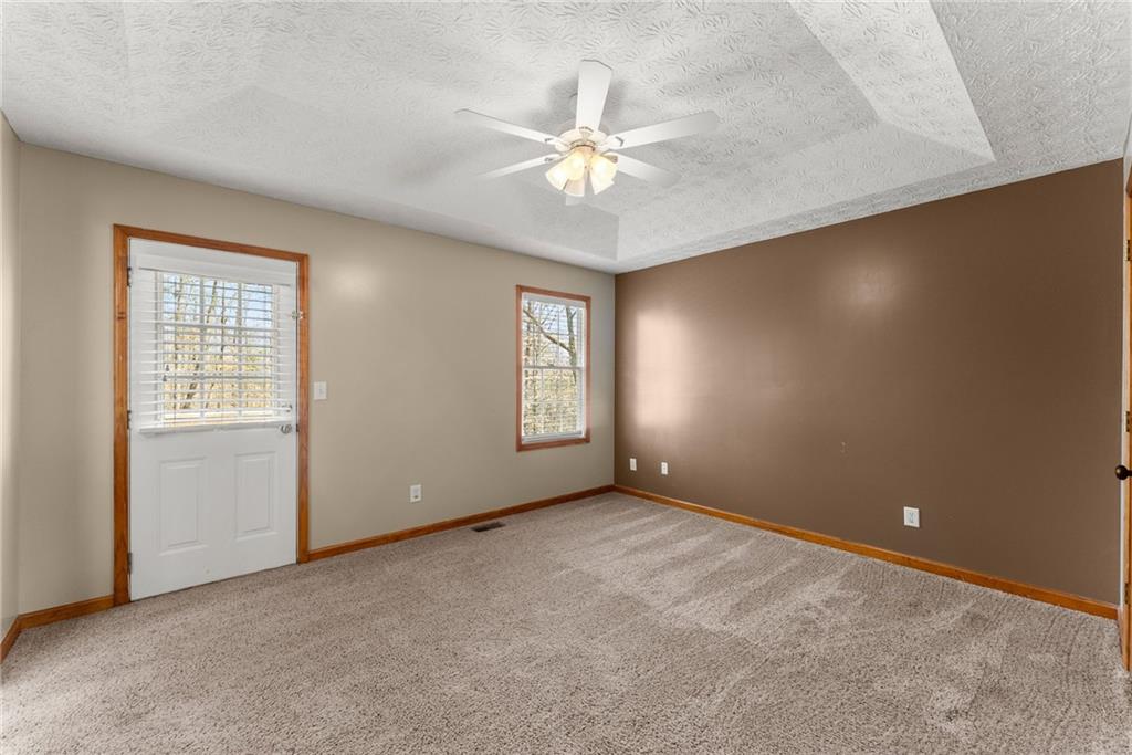 662 Maley Road Jefferson, GA 30549 - Photo 21 of 43 an empty room with windows and fan