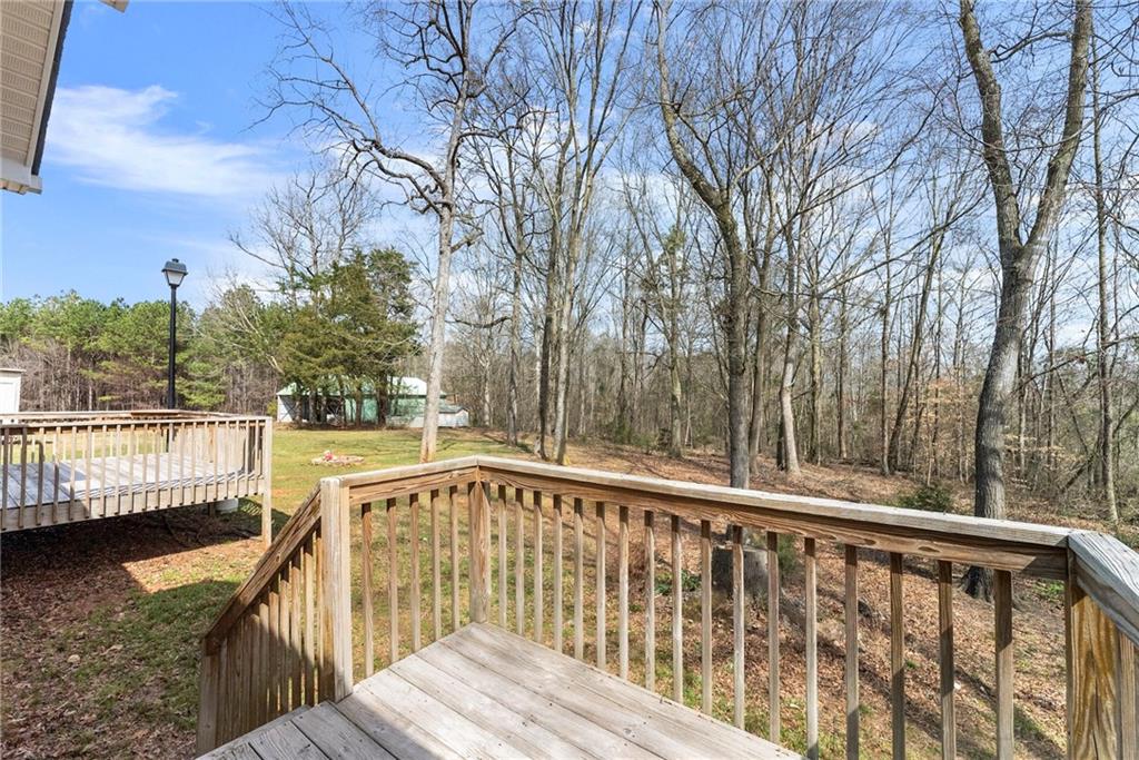 662 Maley Road Jefferson, GA 30549 - Photo 34 of 43 a view of balcony with wooden floor and fence