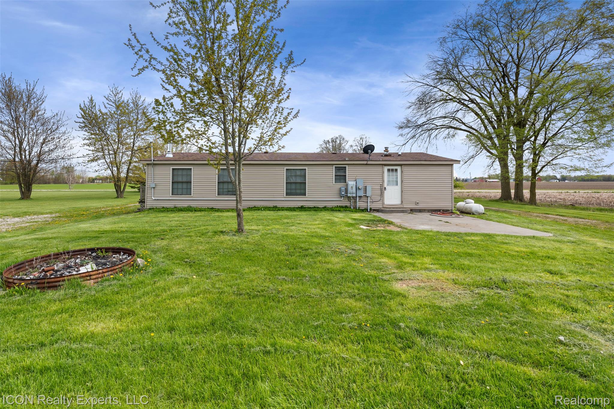 13620 Gilbert Road Allenton, MI 48002 - Photo 26 of 47 Back of house featuring a lawn and a patio area