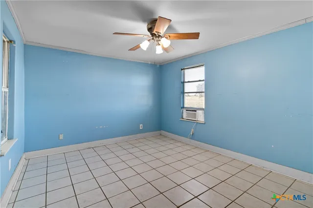 a view of an empty room and window