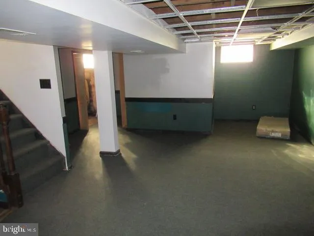 a view of an empty room with stairs